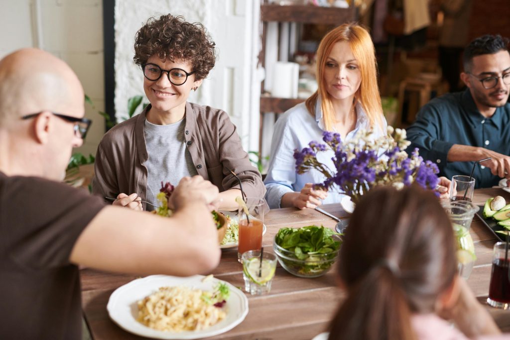 REAL Health & Nutrition. Group of people eating happy.